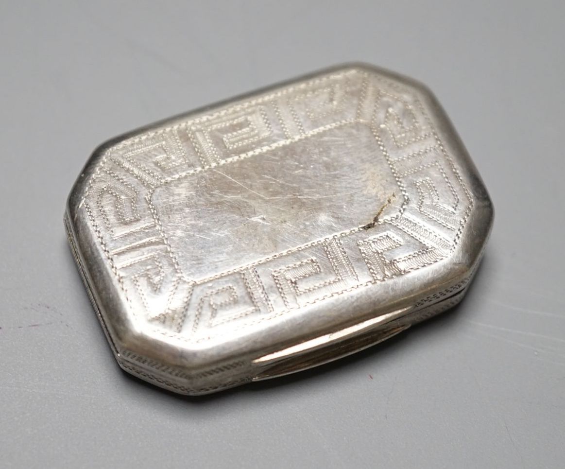A George III engraved silver octagonal vinaigrette, by Samuel Pemberton, Birmingham, 1806, 36mm.